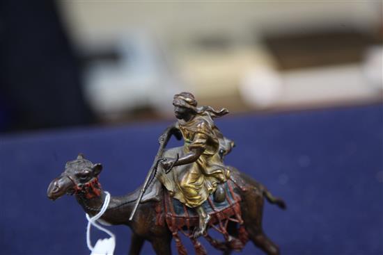 Franz Bergman. A cold painted bronze model of an arab riding a camel, height 5in.